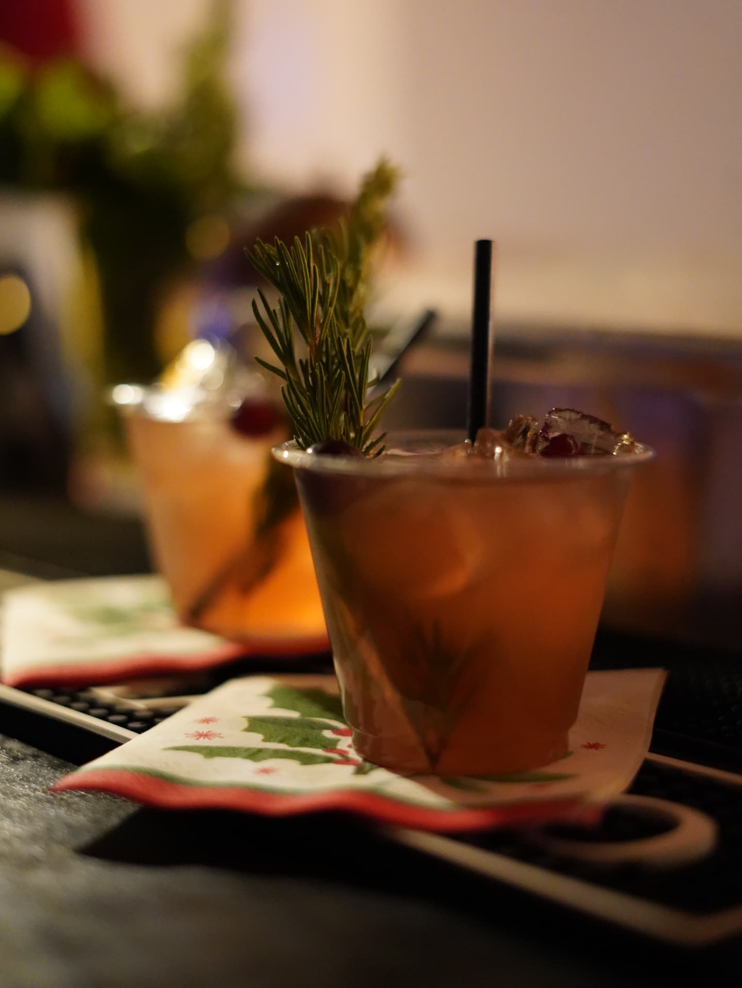A signature holiday cocktail garnished with rosemary